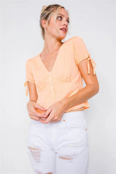 Light Orange Short Sleeve V-Neck Button Front Top with Puff Sleeves and Tie Detail
